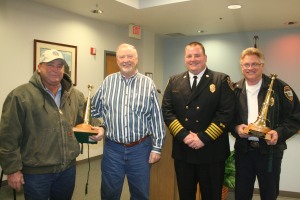Fire Chief Eric Harlow and Mayor Chuck Burtcher recognized Rodney Davison (left) and Charles Stowe (right) for their 25 years of service and retirement. Photo By Chris Evans
