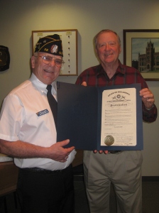 Albert Hawkes (L), American Legion Post 58 Commander, presents Guthrie Mayor, Chuck Burtcher (R), with the  Governor’s 2013 Proclamation recognizing Guthrie as the official ‘89er Celebration city of Oklahoma.