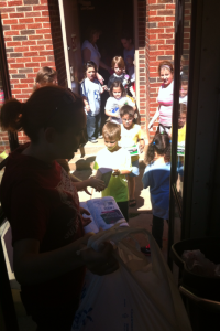 Students at Central Elementary help fill the bus up with donations for those affected by the tornadoes.