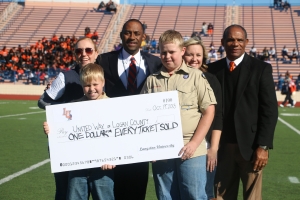Langston presents “Homecoming Check” to United Way of Logan County.  Pictured from Left to Right: Ashleigh Sorrell Rose, United Way; Dylan Jones; Dr. Kent Smith, Langston University President; Cody Jones; Jessica Eaves, United Way; and Mike Garrett; Langston University Athletic Director