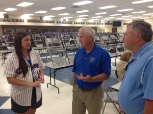 Gary Boxley (center) talks with Jordan Hodge and Ron Gillet following his retirement reception inside the GHS cafeteria.