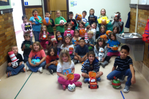 Students show off their pumpkins and await the big donut party on Friday.