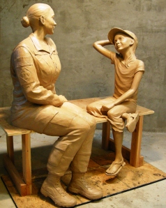 The seated sculpture of mother and child in clay representing the sacrifice servicewomen make being away from their families shows how a Women's Veteran Monument will look when it is dedicated Nov. 11 at Patriot Park in Del City, Okla. Photo by Joel Randell.
