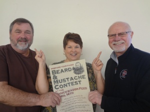 Tami Boxley, center, examines the beards of prospective ‘89er contestants, Dave Wolek (L) and Jerry Ball (R).